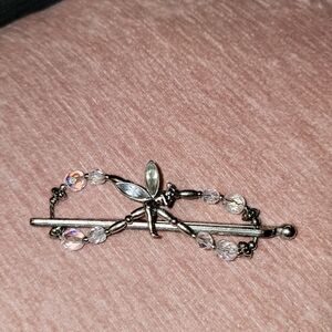 This is a silver-toned fairy hair clip with aurora borealis crystals.
